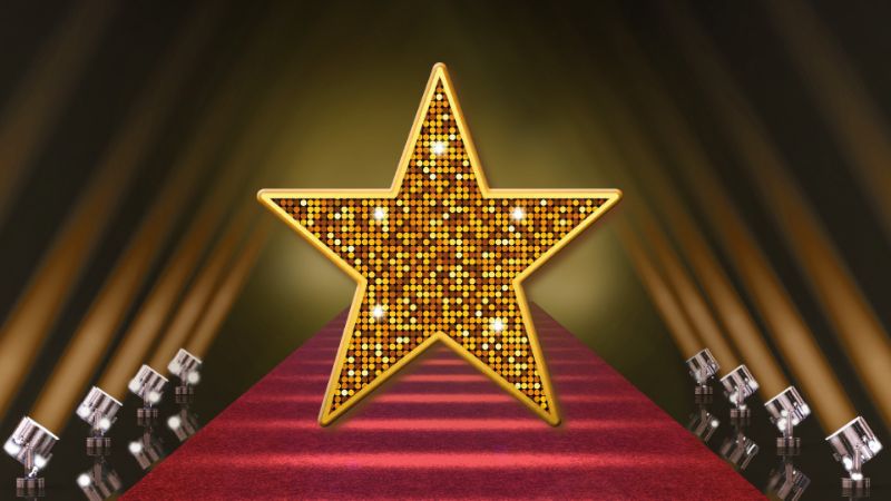 Tapis rouge menant à une étoile dorée.